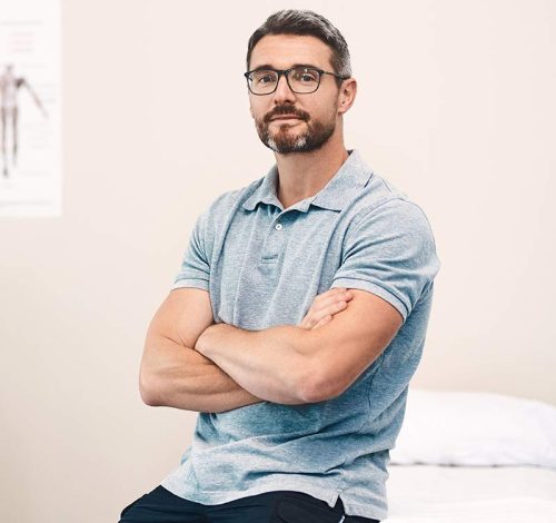 portrait-of-a-handsome-mature-male-physiotherapist-2023-11-27-05-35-10-58VRXXZ.jpg